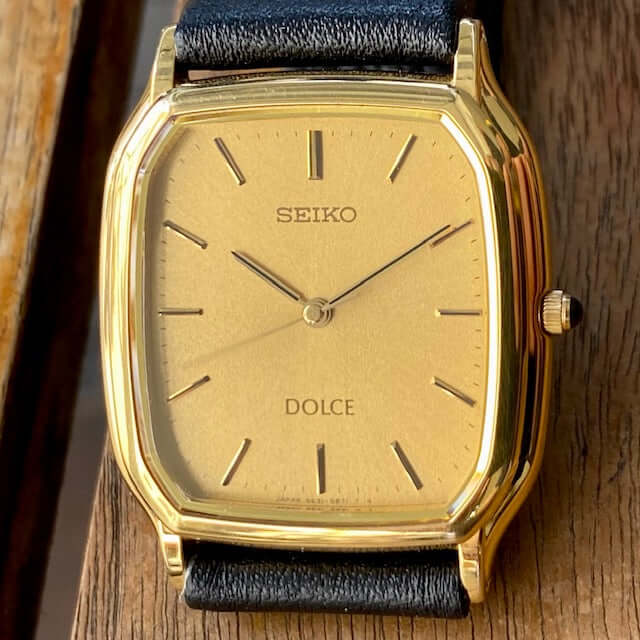 Vintage Seiko Dolce Quartz Tank 5E31-5B30 with gold sunburst dial and black leather strap