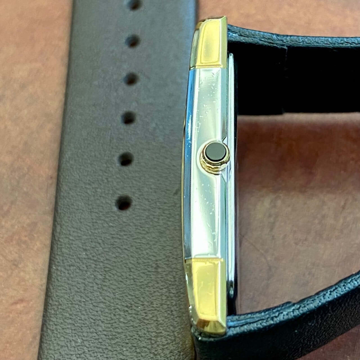 Vintage Seiko Dolce Quartz Tank 6020-5980 side view showcasing GHA case and leather strap.