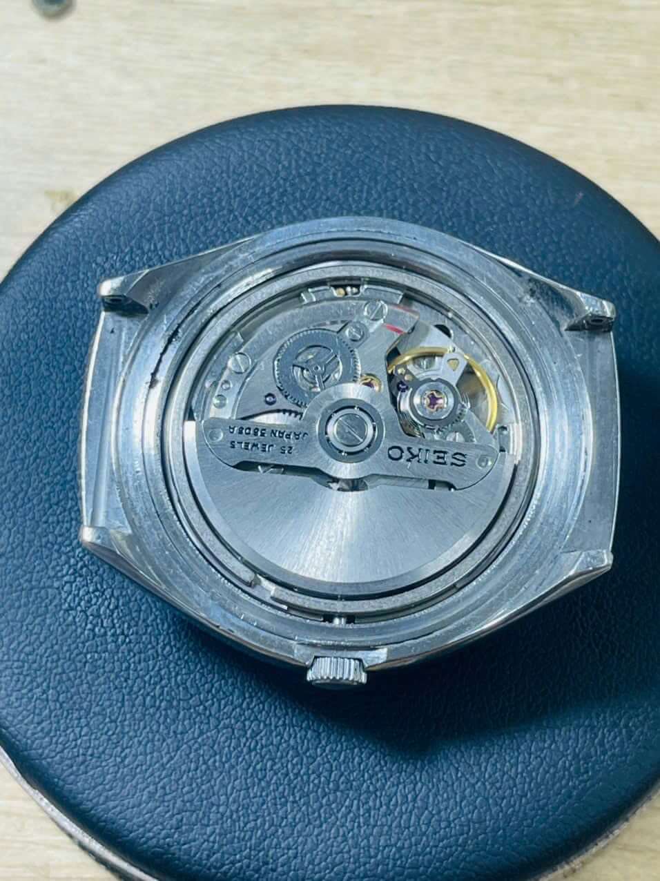 Vintage Seiko Lord Matic 5606-7300 automatic watch movement detail, showing intricate mechanics and craftsmanship.