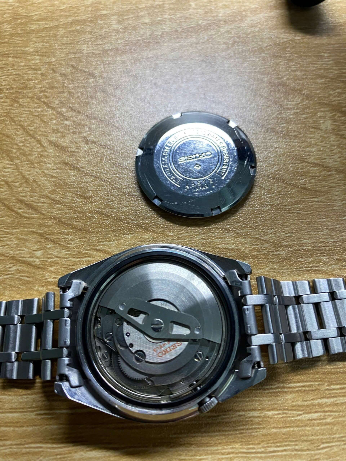 Vintage Seiko 5 SS Actus 6106-7510 watch movement with case back removed, showcasing the stainless steel design.