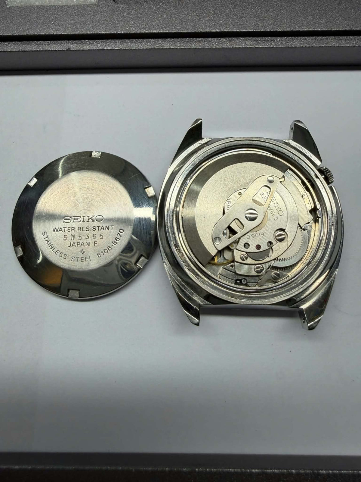 Seiko 5 Actus SS 6106-8670 automatic watch movement and case back detail, made in Japan.
