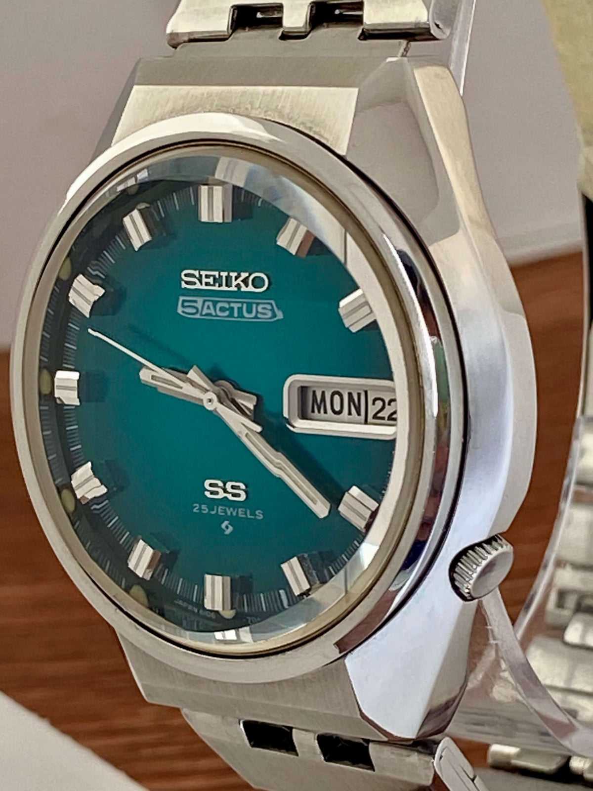 Vintage Seiko 5 Actus 6106-7690 watch featuring a rare turquoise dial and stainless steel case, made in November 1973.