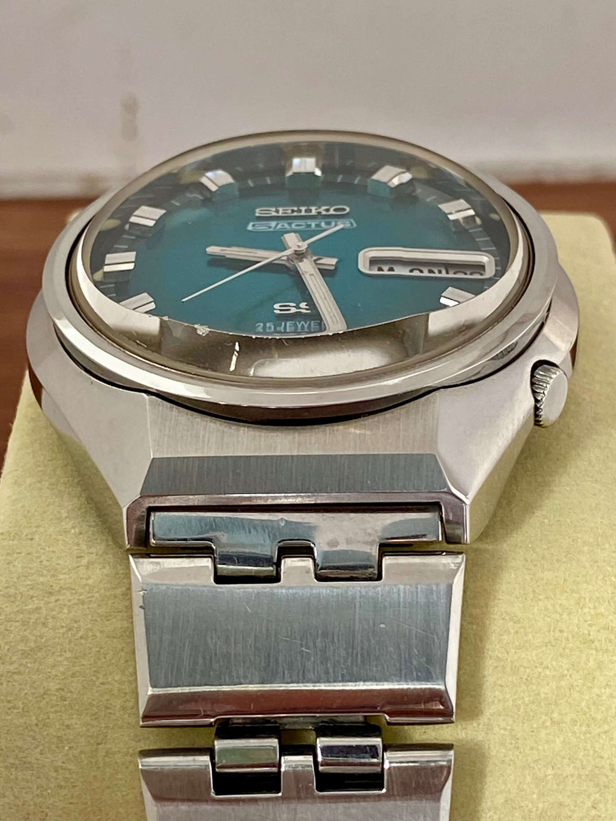 Vintage Seiko 5 Actus 6106-7690 watch with rare turquoise dial, showing stainless steel case and excellent condition.