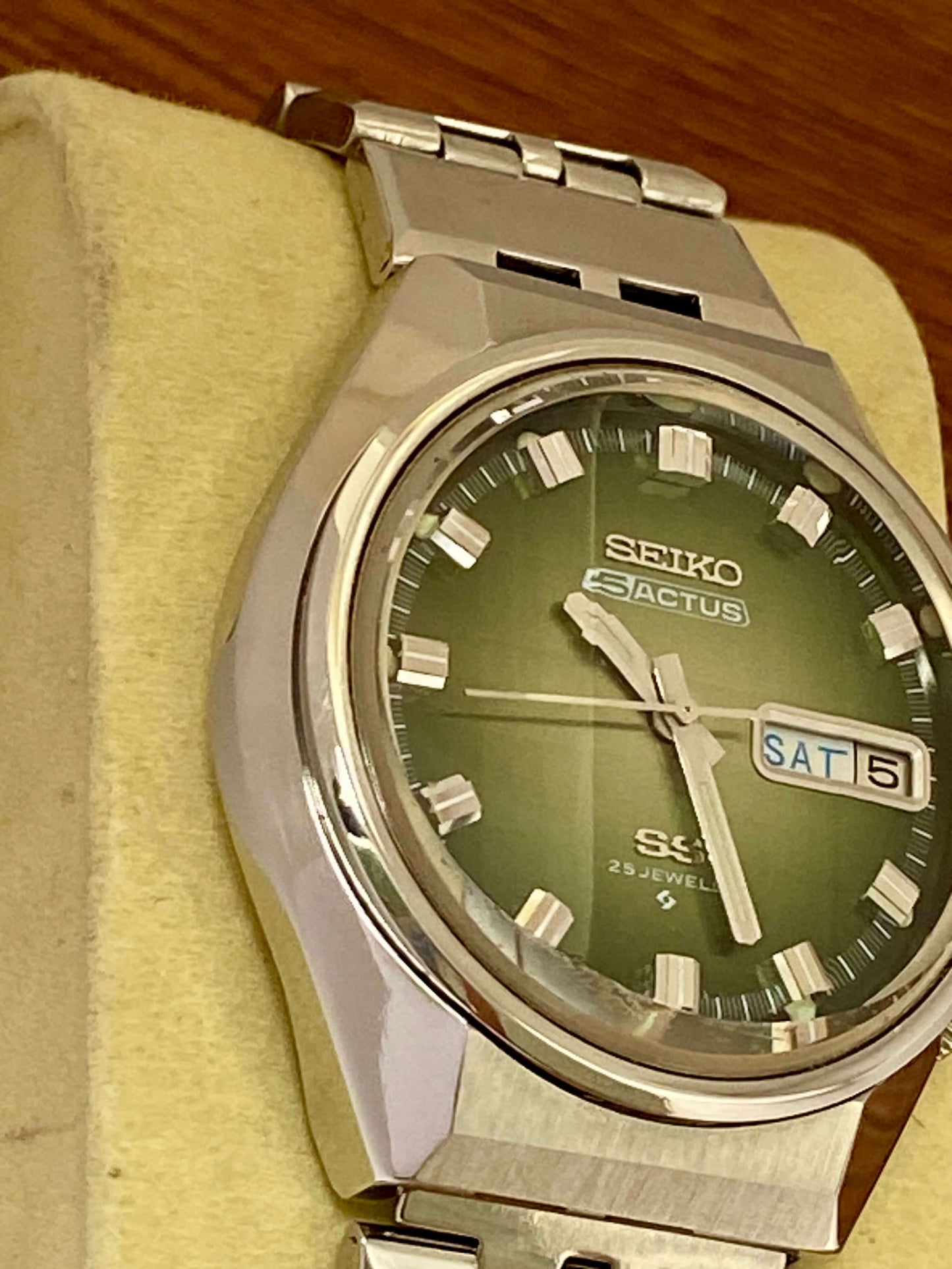Vintage Seiko 5 Actus 6106-7690 with Green Dial in excellent condition on a display.