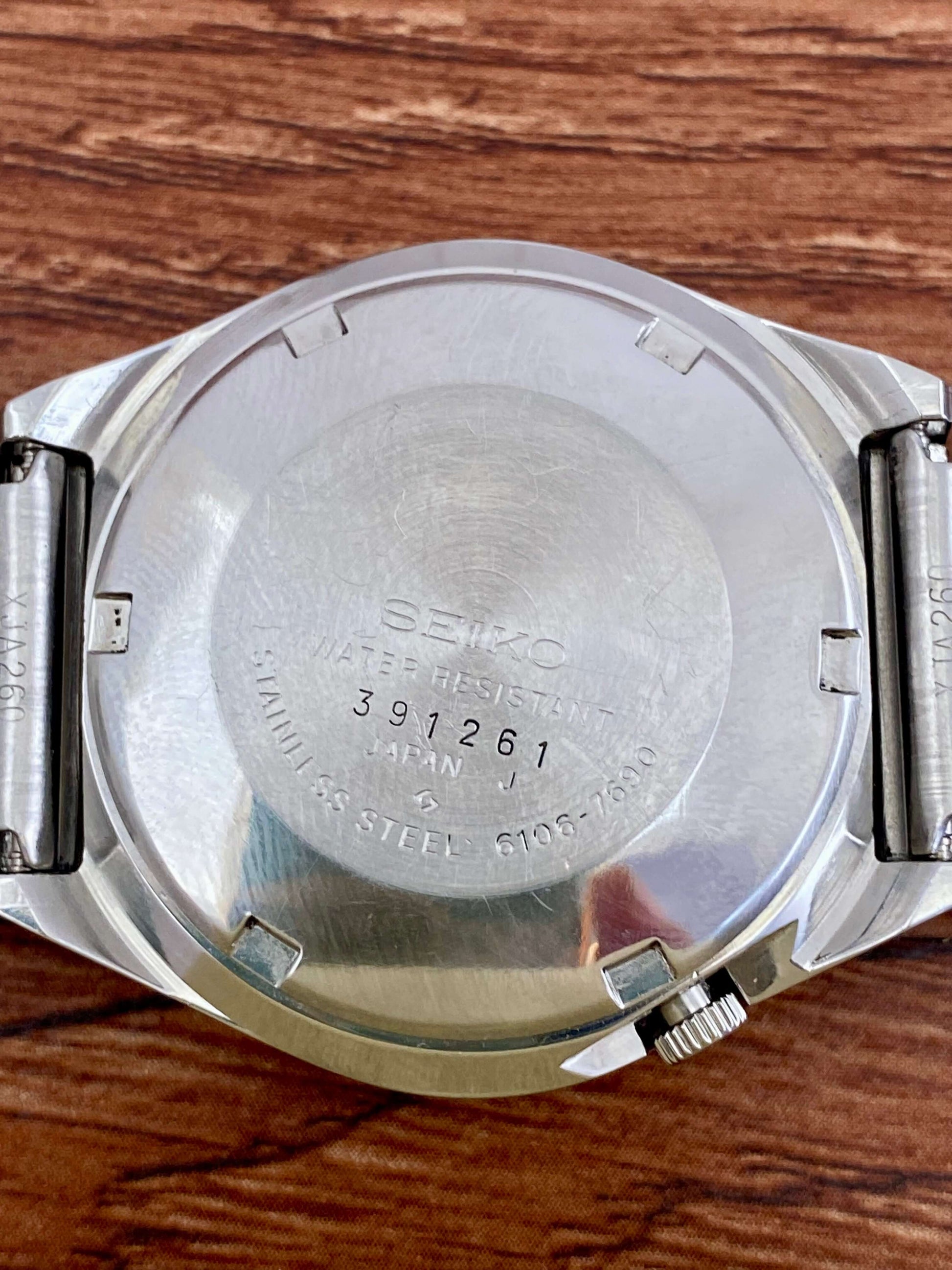 Vintage Seiko 5 Actus 6106-7690 watch case back with serial number 391261, stainless steel finish.