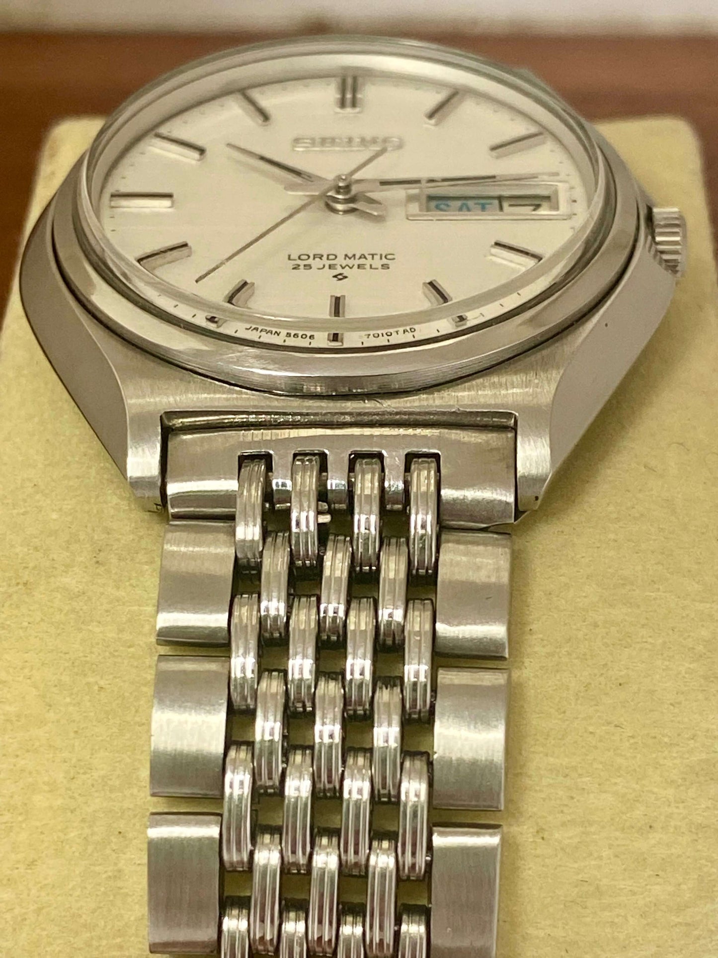 Vintage Seiko Lord Matic 5606-7010 with original white linen dial and stainless steel bracelet, serviced automatic.
