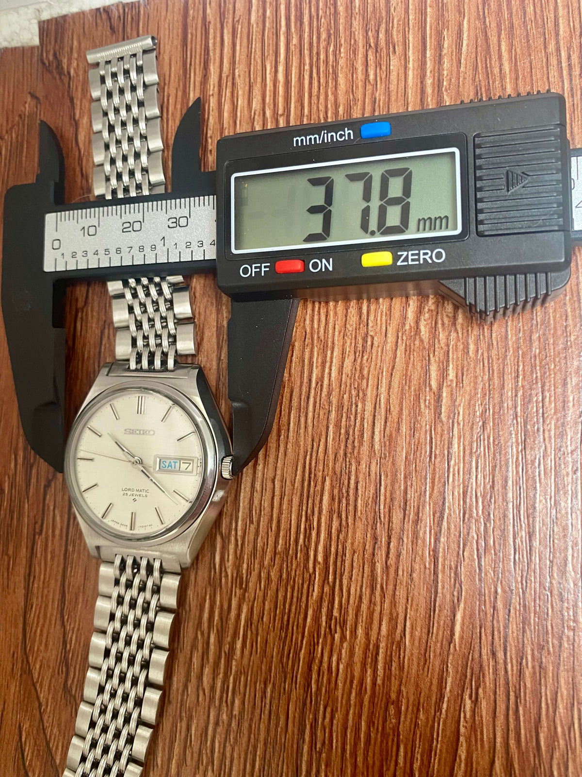 Vintage Seiko Lord Matic 5606-7010 with size measurement showing 37.8mm