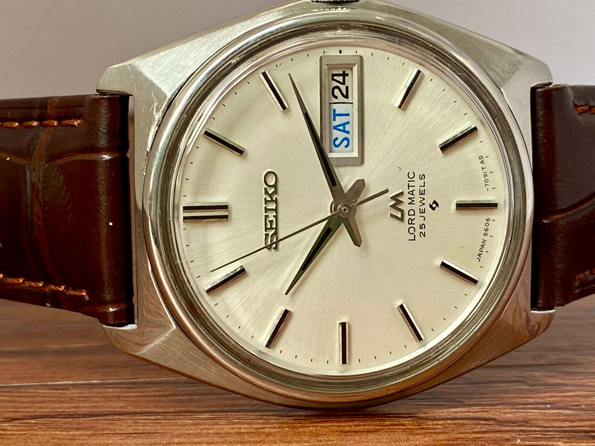 Vintage Seiko Lord Matic 5606-7000 watch face with bilingual day/date, original dial, June 1969.