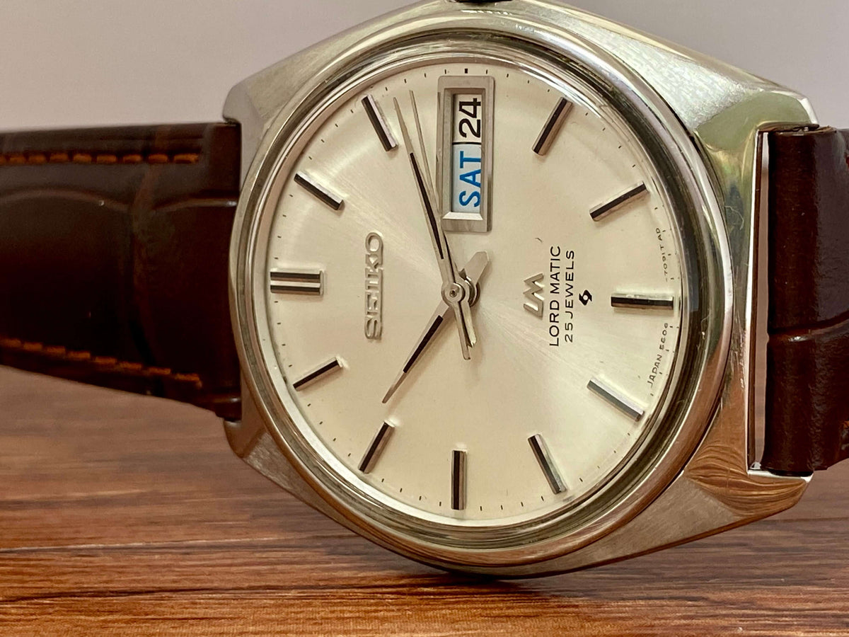 Vintage Seiko Lord Matic 5606-7000 watch close-up showing original dial and date display.