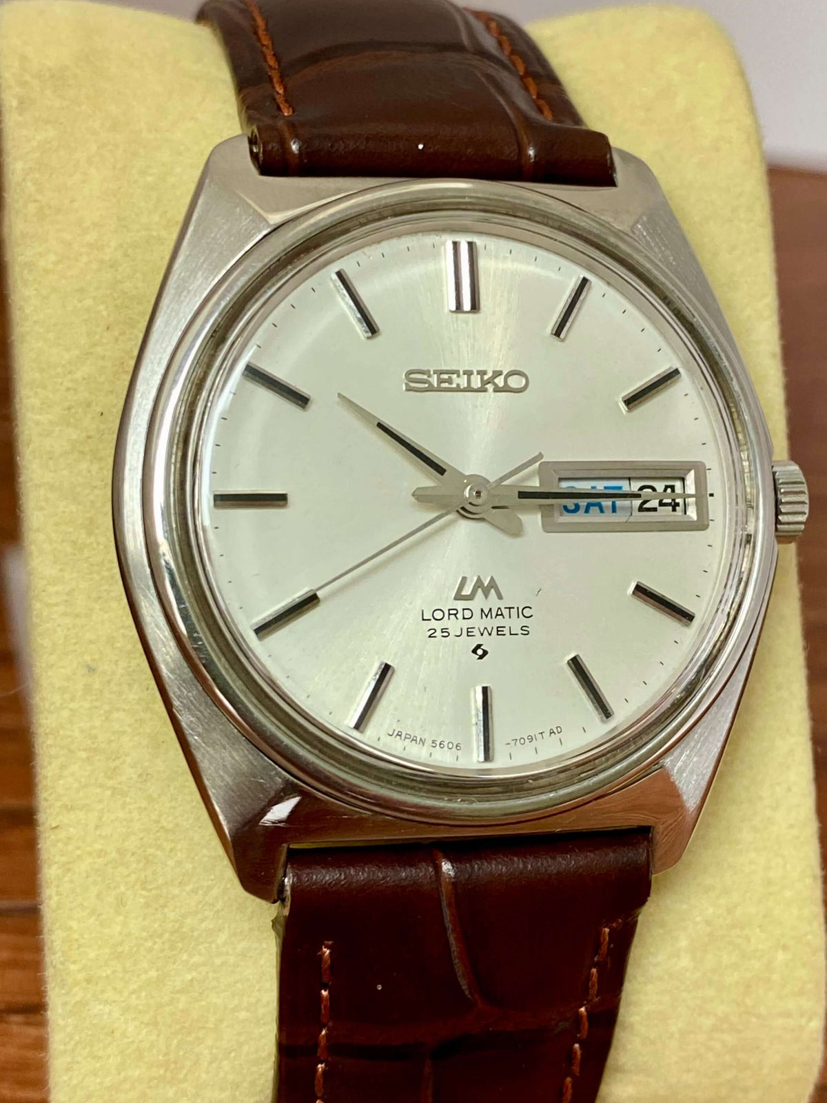 Vintage Seiko Lord Matic 5606-7000 watch with silver dial and brown leather strap, made in Japan in June 1969.