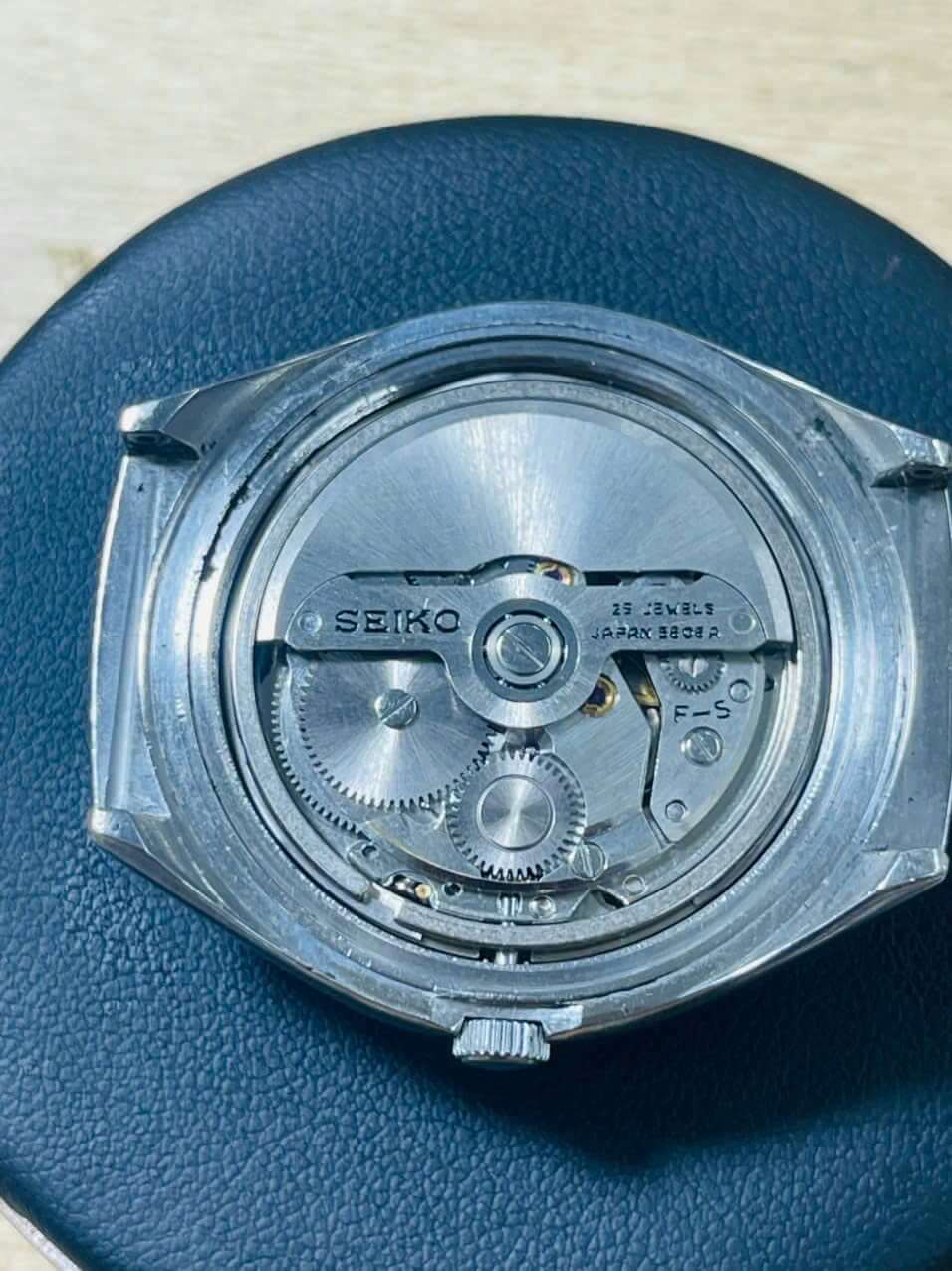 Vintage Seiko Lord Matic 5606-7300 watch movement showing intricate details of the mechanism and craftsmanship.